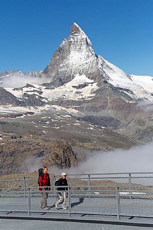 Hikers at the Gornergrat, in the background the Matterhorn or Cervino mount, Zermatt, Valais, Switzerland, Europe
