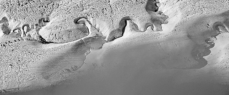 Detail of stream in the Gorner glacier from Gornergrat mountain top, Monte Rosa or Breithorn mountain range, Zermatt, Valais, Switzerland, Europe
 