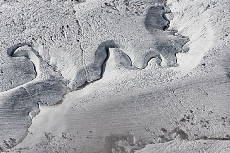 Detail of stream in the Gorner glacier from Gornergrat mountain top, Monte Rosa or Breithorn mountain range, Zermatt, Valais, Switzerland, Europe
 