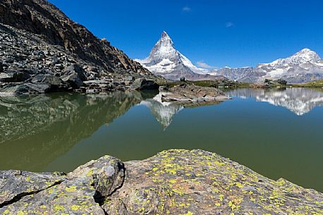 The Matterhorn or Cervino mount reflected in the Riffelsee Lake (Riffel lake), Gornergrat, Zermatt, Valais, Switzerland, Europe
 