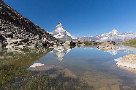 The Matterhorn or Cervino mount reflected in the Riffelsee Lake (Riffel lake), Gornergrat, Zermatt, Valais, Switzerland, Europe
The Matterhorn or Cervino mount reflected in the Riffelsee Lake (Riffel lake), Gornergrat, Zermatt, Valais, Switzerland, Europe