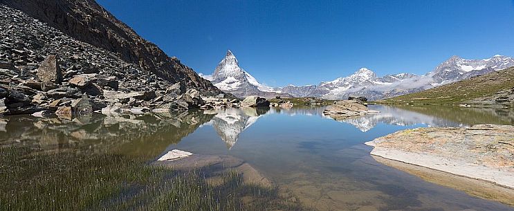 The Matterhorn or Cervino mount reflected in the Riffelsee Lake (Riffel lake), Gornergrat, Zermatt, Valais, Switzerland, Europe
 