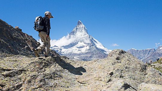 Child in the path of Gornergrat area, towards the Matterhorn or Cervino mount, Zermatt, Valais, Switzerland, Europe