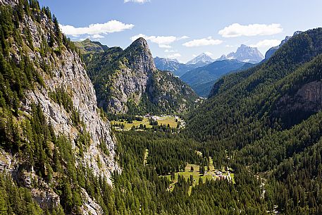 View from val Ombretta valley in the Marmolada mountain range towards Malga Ciapela and Piz Guda, Antelao and Pelmo mounts in the background, dolomites, Veneto, Italy, Europe