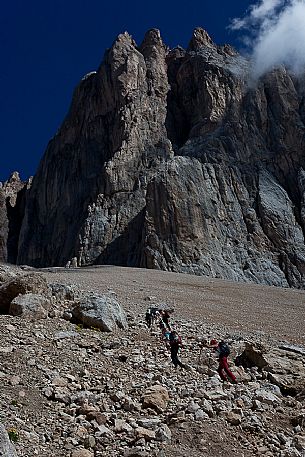 Hikers in the Marmolada mountain range, Ombretta valley, dolomites, Veneto, Italy, Europe Hikers in the Marmolada mountain range, Ombretta valley, dolomites, Veneto, Italy, Europe