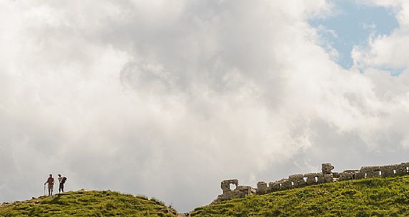 Hikers visit the remains of the world war in Sesis valley, Sappada, dolomites, Friuli Venezia Giulia, Italy, Europe