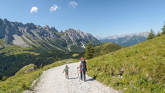 Family near the source of the Piave river, Sappada, dolomites, Friuli Venezia Giulia, Italy, Europe