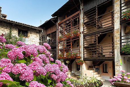 Traditional house with the dalz, the typical wooden balcony in the small village of Andreis, Friuli Venezia Giulia, dolomites, Italy, Europe Traditional house with the dalz, the typical wooden balcony in the small village of Andreis, Friuli Venezia Giulia, dolomites, Italy, Europe