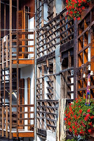 Detail of traditional house with the dalz, the typical wooden balcony in the small village of Andreis, Friuli Venezia Giulia, dolomites, Italy, Europe Detail of traditional house with the dalz, the typical wooden balcony in the small village of Andreis, Friuli Venezia Giulia, dolomites, Italy, Europe