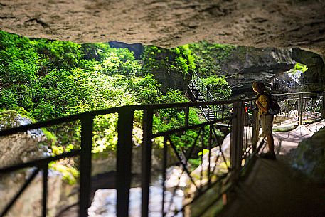 Child visiting the Pradis Caves, Clauzetto, Friuli Venezia Giulia, Italy, Europe