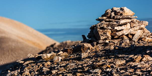 Pile of rocks on the top of Focalone mount, in the background the slope of Acquaviva mount, amphitheater of the Murelle, Majella national park, Abruzzo, Italy, Europe