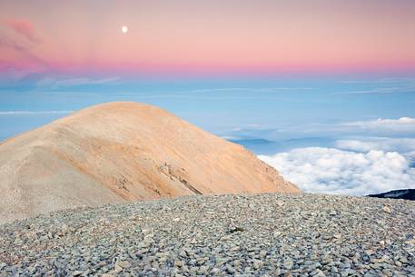 The moon rise over the Mount Acquaviva in the amphitheater of the Murelle, Majella national park, Abruzzo, Italy, Europe