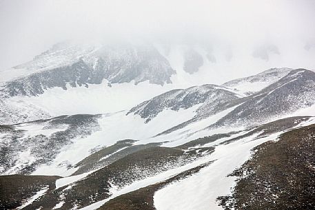 Thaw in the slope of Campo Imperatore, Gran Sasso and Monti della Laga national park, Abruzzo, Italy, Europe Thaw in the slope of Campo Imperatore, Gran Sasso and Monti della Laga national park, Abruzzo, Italy, Europe