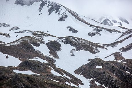 Thaw in the slope of Campo Imperatore, Gran Sasso and Monti della Laga national park, Abruzzo, Italy, Europe Thaw in the slope of Campo Imperatore, Gran Sasso and Monti della Laga national park, Abruzzo, Italy, Europe