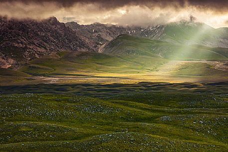Beautiful light in the thunderstorm over Campo Imperatore, Gran Sasso national park, Abruzzo, Italy, Europe Beautiful light in the thunderstorm over Campo Imperatore, Gran Sasso national park, Abruzzo, Italy, Europe