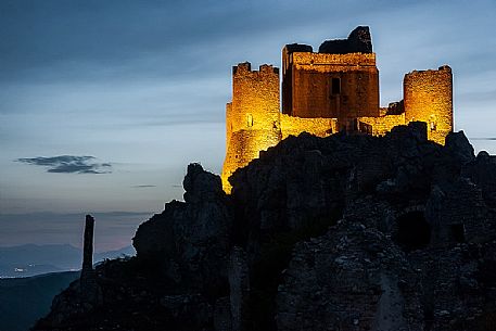 Rocca Calascio castle and the small villages in the valley at twilight, Gran Sasso national park, Abruzzo, Italy, Europe Rocca Calascio castle and the small villages in the valley at twilight, Gran Sasso national park, Abruzzo, Italy, Europe