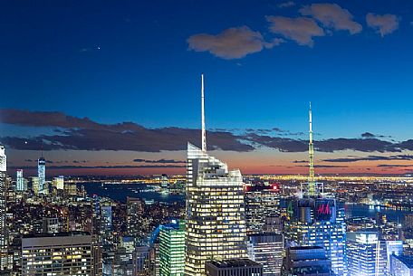 Cityscape of Manhattan at twilight, view from the Top of the Rock observation deck at Rockfeller Center, Manhattan, New York City, USA Cityscape of Manhattan at twilight, view from the Top of the Rock observation deck at Rockfeller Center, Manhattan, New York City, USA
