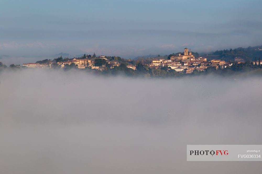 The small village of Grazzano Badoglio in the fog, Monferrato, Piedmont, Italy, Europe