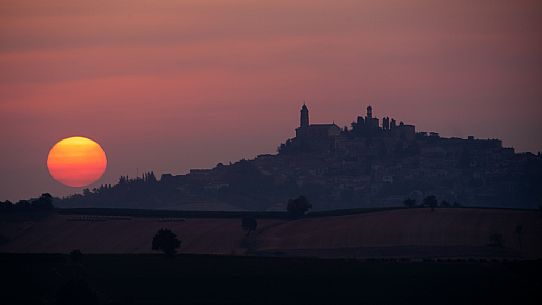 Silhouette of Vignale Monferrato with the clock tower and the castle at sunrise, Monferrato, Piedmont, Italy, Europe