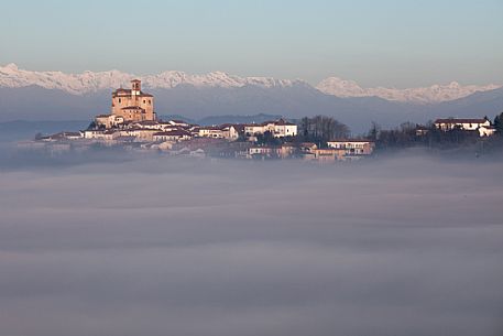 The church of Treville, one of the highest place in Monferrato, in the fog. On the background the Alps, Monferrato, Piedmont, Italy, Europe
