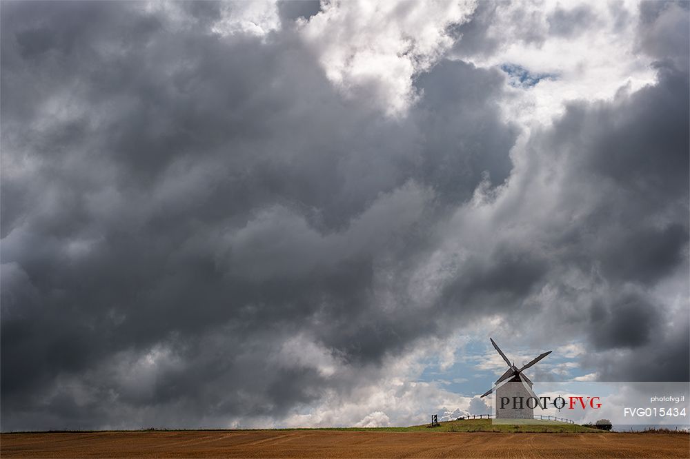 Near the famous Mont Saint Michel you can see picturesque windmills facing the storm