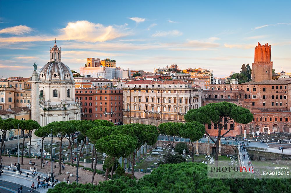 Beautiful point of view in Rome. You can see the traian markets on the right and the traian column on the left. In the foreground you can also see the maritime pines, which are typical of Rome's urban cityscape.