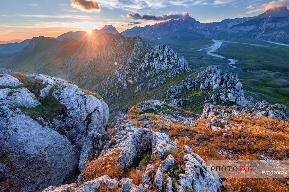 The Gran Sasso mountains and peaks seen from Mount Bolza's ridge at sunset