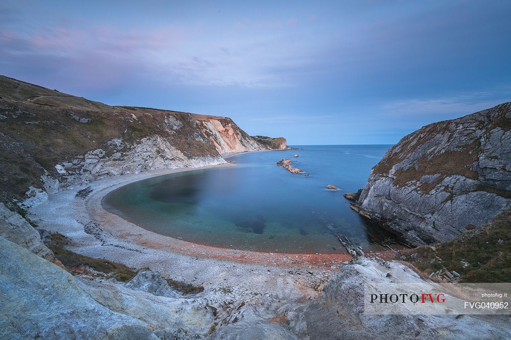 St. Oswald Bay, also known as Man O' War Bay is located right next door to Durdle Door , and has a beautiful half moon shape, Dorset, England, UK