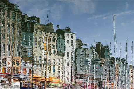 Honfleur, in Normandy, is known as a city of impressionist painters. Watching the reflections in the port's water you can easily imagine an impressionist paint.