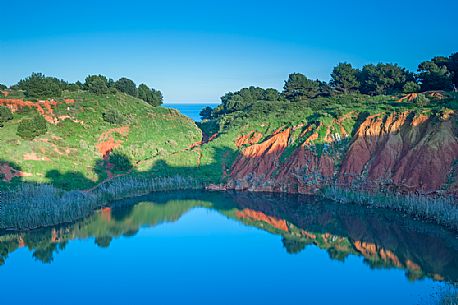 The Bauxite quarry of Otranto is one of the things to do during the holidays in Salento. It is located near the lighthouse of Punta Palascia and Monte Sant'Angelo. In this field the now abandoned mining has formed an emerald green lake that makes one really extraordinary view. The Bauxite quarry of Otranto is one of the things to do during the holidays in Salento. It is located near the lighthouse of Punta Palascia and Monte Sant'Angelo. In this field the now abandoned mining has formed an emerald green lake that makes one really extraordinary view.