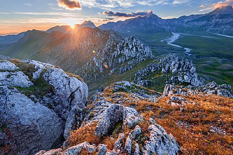 The Gran Sasso mountains and peaks seen from Mount Bolza's ridge at sunset