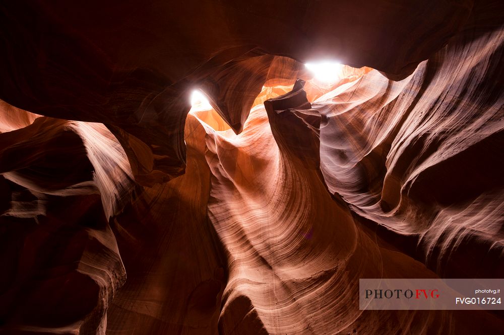 Inside Antelope canyon: the sun shines between the red rocks