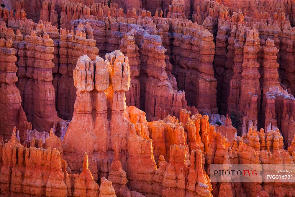 Rocks sculpted by wind and rain in Bryce Canyon , called hoodoos , are believed by the native, to be the ancient petrified inhabitants of this country.