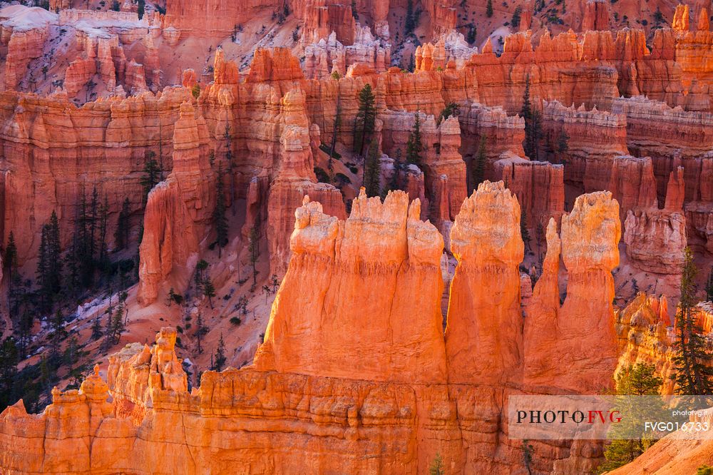 Rocks sculpted by wind and rain in Bryce Canyon , called hoodoos , are believed by the native, to be the ancient petrified inhabitants of this country.