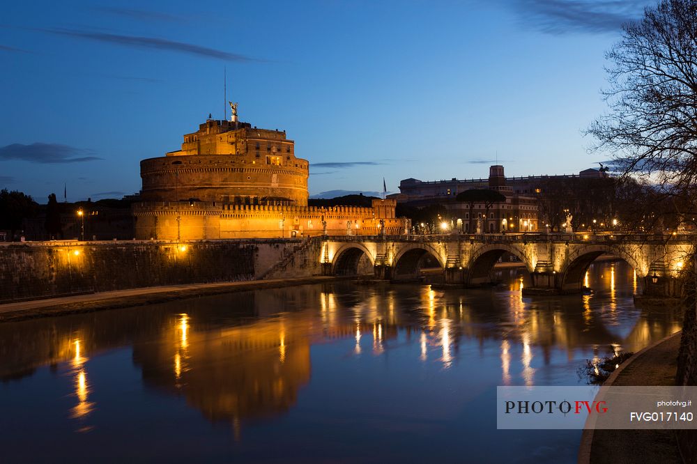 Castel Sant'Angelo and the bridge Sant'Angelo illuminated with the blue sky before the dawn