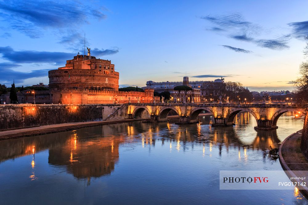 Castel Sant'Angelo and the bridge Sant'Angelo illuminated with the blue sky before the dawn