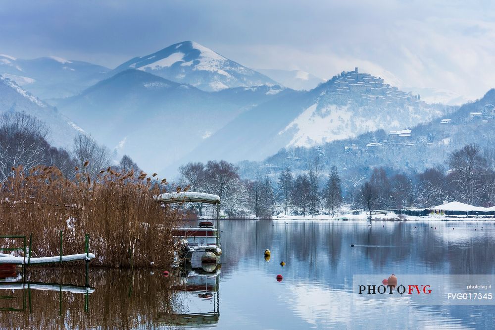 The ancient medieval village of Labro, in  Rieti's province, Lazio. On the background  mountains, covered by snow. Piediluco's lake waters in foreground.