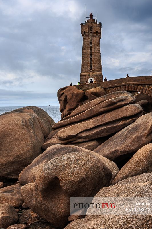 Pink Granite coast, pointe De Squewel, the Mean Ruz lighthouse built of granite from Ploumanac'h, Ctes-d'Armor province, Brittany, France, Europe