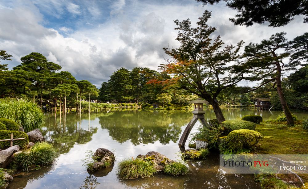 Stone lantern in the lake of Kenroku-en garden, garden of the six sublimities, ancient garden in the city of Kanazawa, Ishikawa Prefecture, Japan. It is considered one of the three most beautiful gardens in Japan.