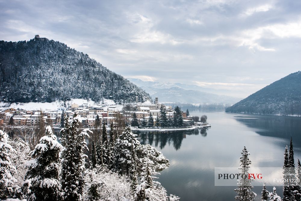 Overview of Piediluco lake and the village covered with snow on a winter day, Umbria, Italy, Europe