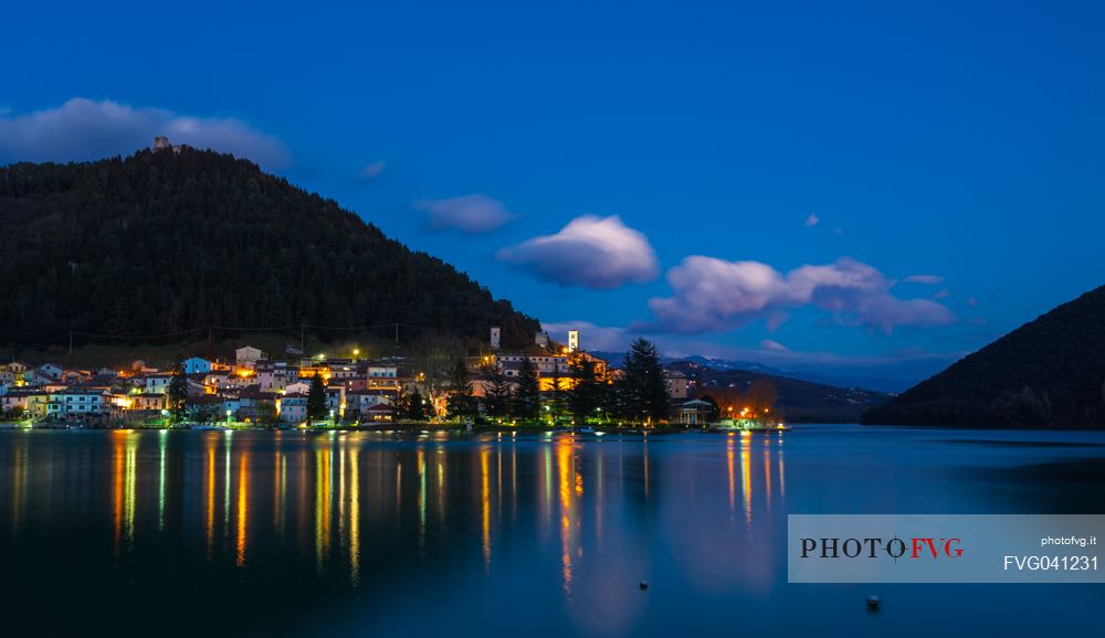 The lake and the village of Piediluco by night with the lights reflected on the water, umbria, Italy, Europe