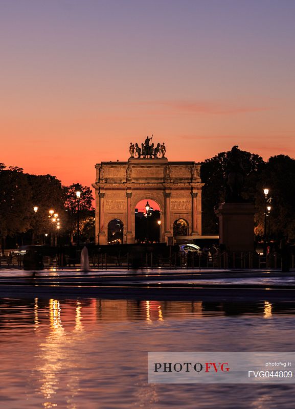 Triumphal arch of the Carrousel seen from the square of the Louvre at sunset, Paris, France, Europe