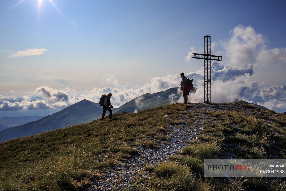 Hikers on top of Pizzo Tre Vescovi peak where you can enjoy a 360  view of the central Apennines, Sibillini national park, Marche, Italy, Europe