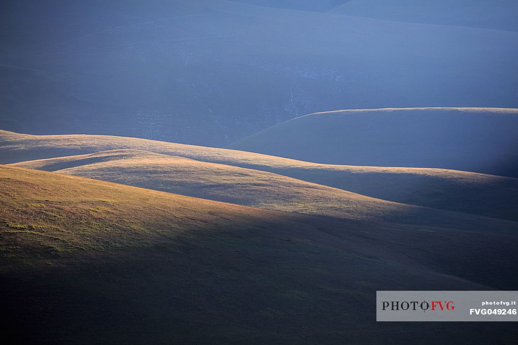 Grazing light on the profiles of the mountains
of Castelluccio di Norcia, Umbria, Italy