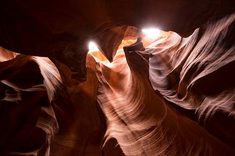 Inside Antelope canyon: the sun shines between the red rocks