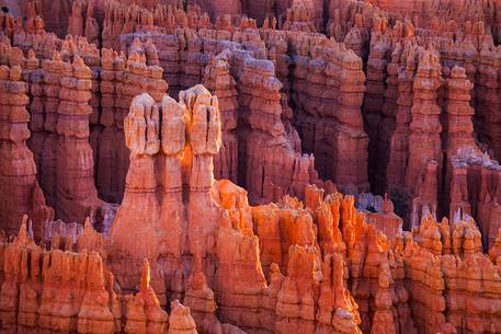 Rocks sculpted by wind and rain in Bryce Canyon , called hoodoos , are believed by the native, to be the ancient petrified inhabitants of this country.