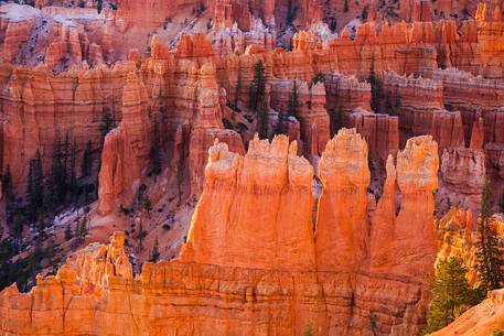 Rocks sculpted by wind and rain in Bryce Canyon , called hoodoos , are believed by the native, to be the ancient petrified inhabitants of this country.