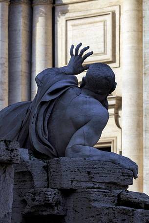 Silohuette of one of the statues of the fountain of the four rivers of the Bernini in Navona plaza. The statue personifies the Rio of the Plata