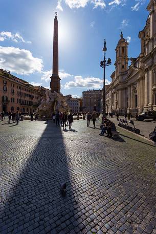 Rome, Navona plaza. The fountain of the four Rivers (of the Bernini) with the obelisk of Domiziano, the church of S. Agnese (of the Borromini) on the right.