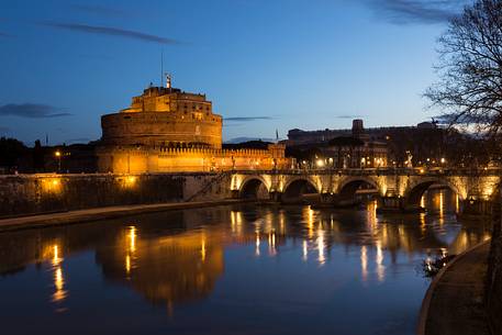 Castel Sant'Angelo and the bridge Sant'Angelo illuminated with the blue sky before the dawn Castel Sant'Angelo and the bridge Sant'Angelo illuminated with the blue sky before the dawn